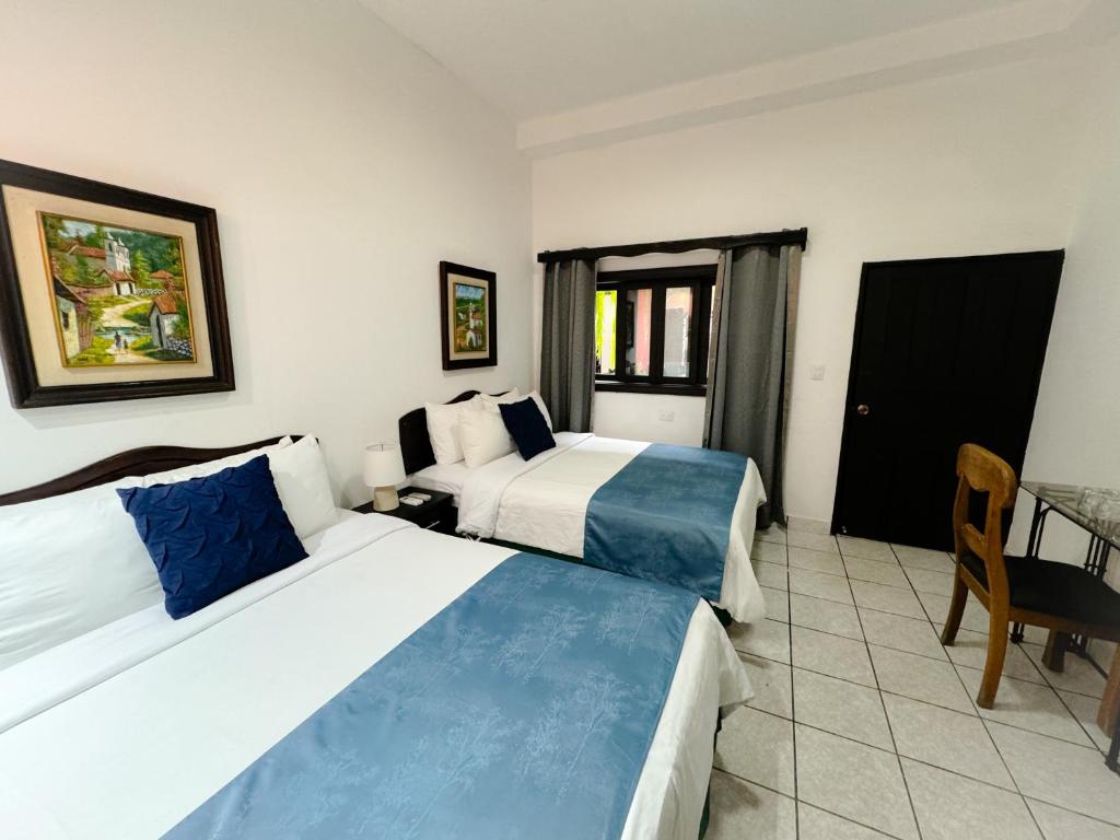 Postel nebo postele na pokoji v ubytování Hotel Camino Maya