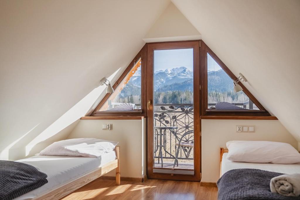 Posteľ alebo postele v izbe v ubytovaní Tatry Panorama