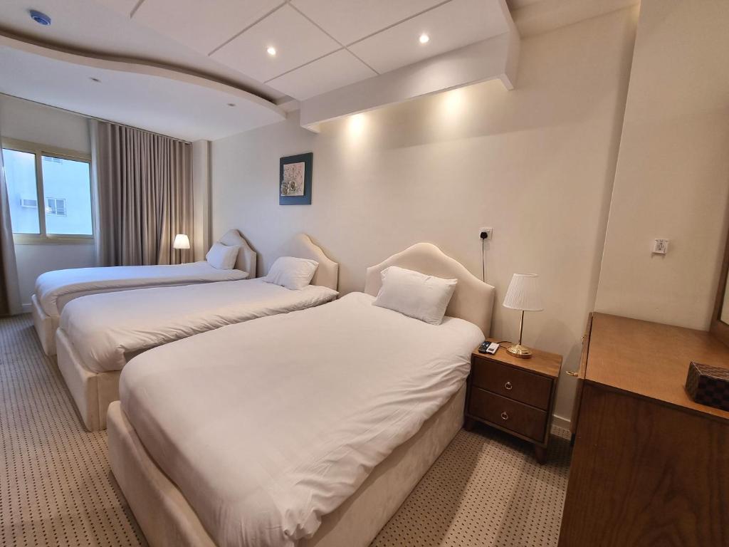 Postel nebo postele na pokoji v ubytování فندق أفين- Avene Hotel