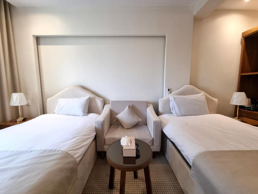Postel nebo postele na pokoji v ubytování فندق أفين- Avene Hotel
