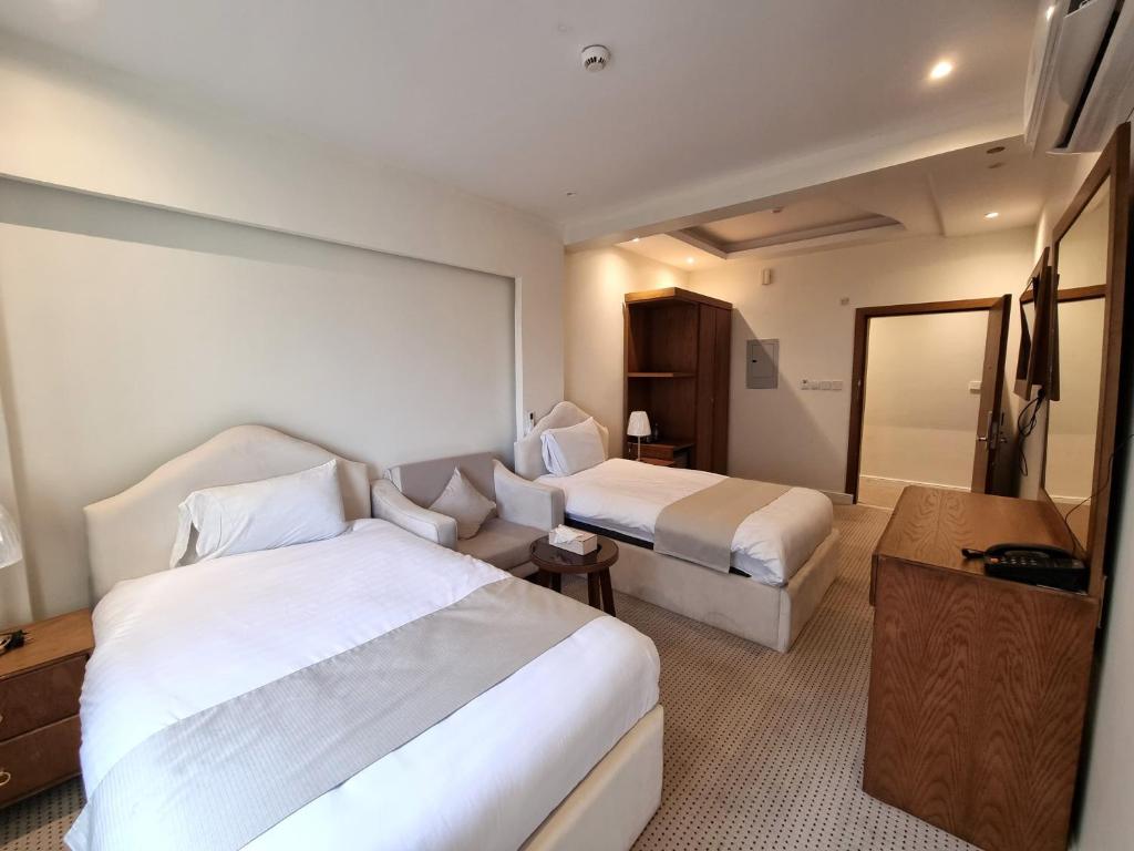 Postel nebo postele na pokoji v ubytování فندق أفين- Avene Hotel