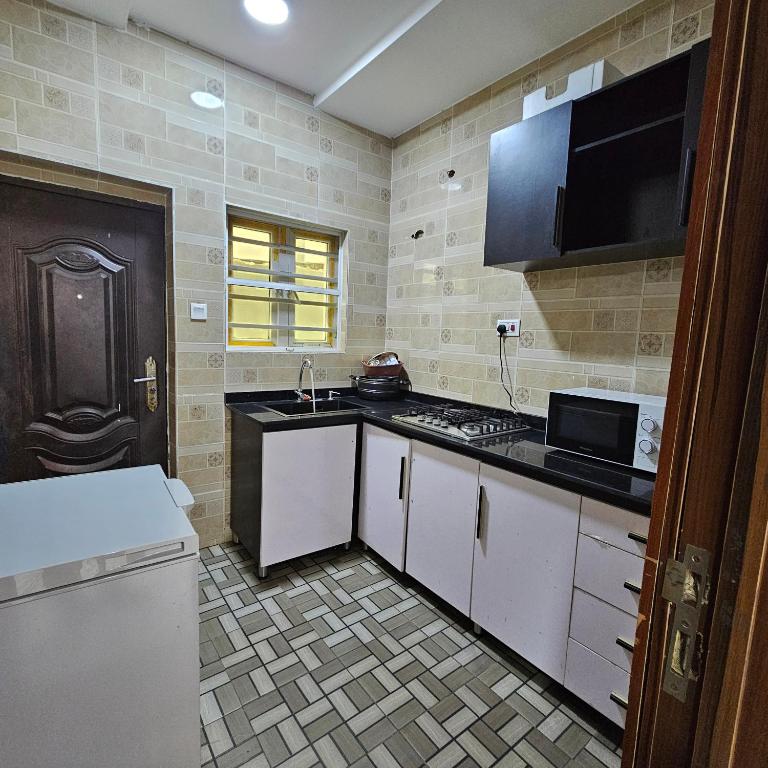 Kuchyň nebo kuchyňský kout v ubytování Hen Cap Apartment Services