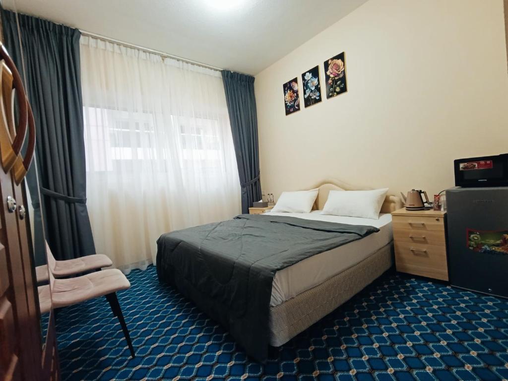 Voodi või voodid majutusasutuse Yasmeen Suite Rooms toas