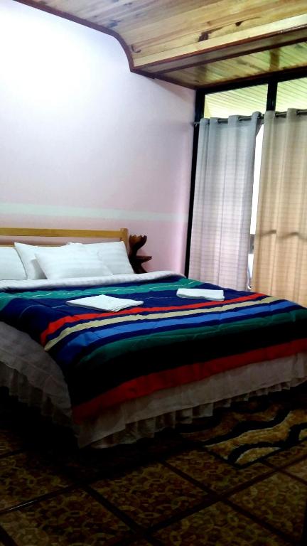 Postel nebo postele na pokoji v ubytování Rice Homestay