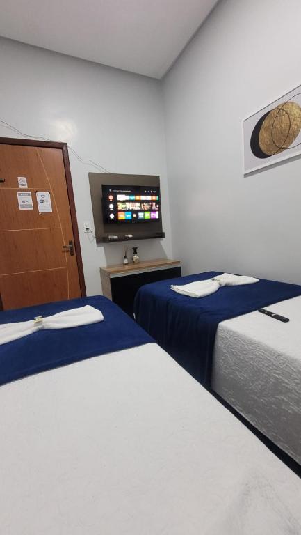 Postel nebo postele na pokoji v ubytování Pousada e Lofts Marabá Quarto 4