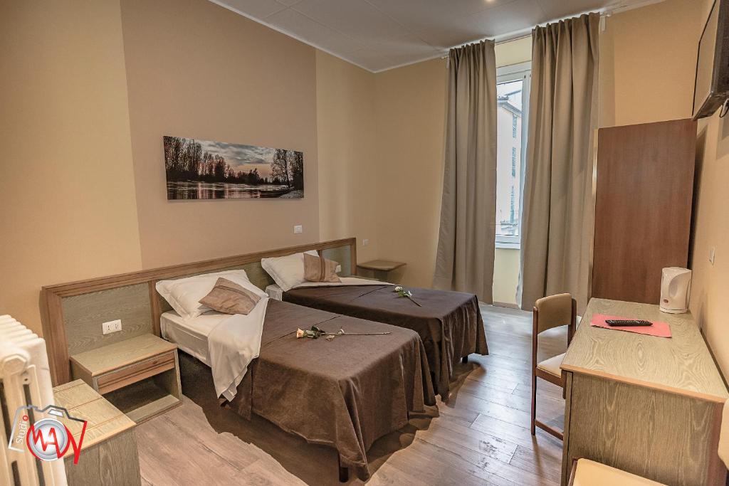Postel nebo postele na pokoji v ubytování Hotel Moderno