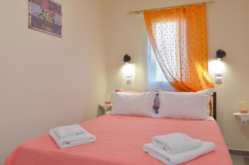 Postel nebo postele na pokoji v ubytování Aggelis Villa