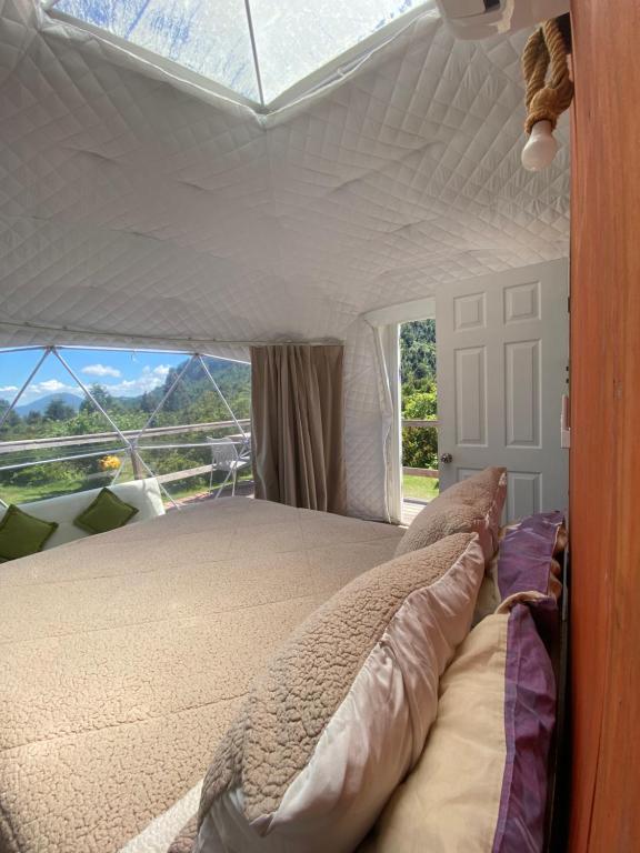 Postel nebo postele na pokoji v ubytování Milenaria Glamping