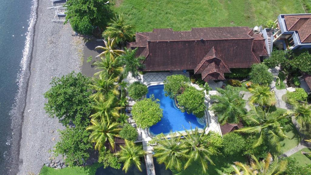 an overhead view of a house with a swimming pool at Arya Amed Beach Resort and Dive Center in Amed