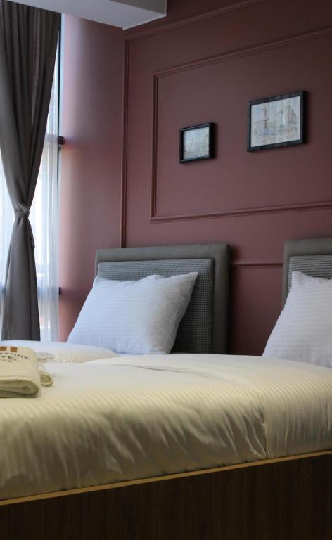 Postel nebo postele na pokoji v ubytování Old Stone Hotel Skopje