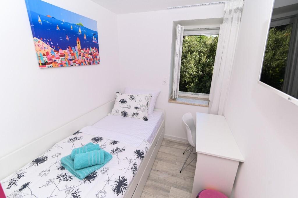 Posteľ alebo postele v izbe v ubytovaní Apartment Sani