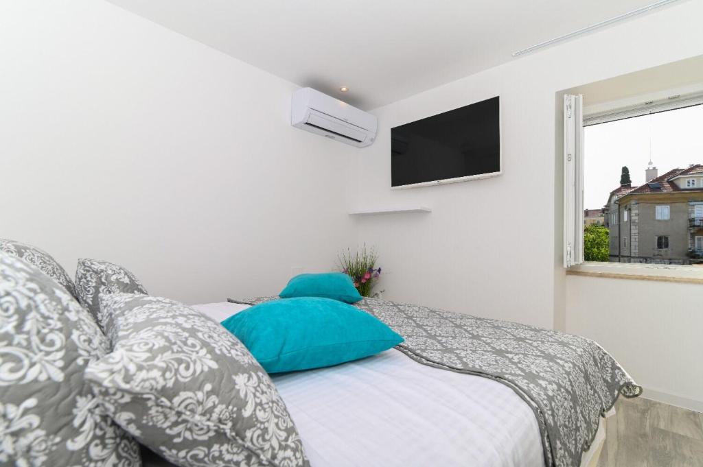 Posteľ alebo postele v izbe v ubytovaní Apartment Sani