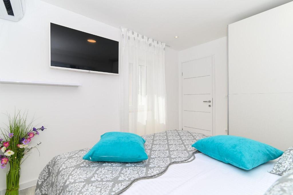 Posteľ alebo postele v izbe v ubytovaní Apartment Sani
