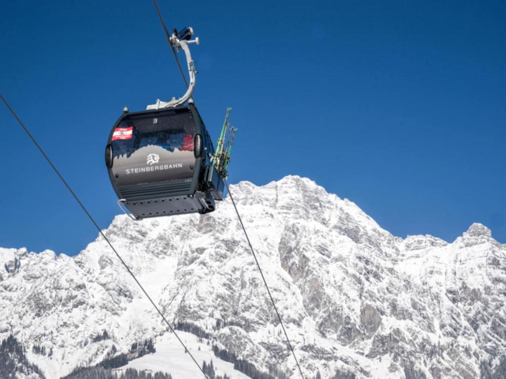 a ski lift over a snow covered mountain at Double room in Saalfelden near Ski Slopes in Saalfelden am Steinernen Meer