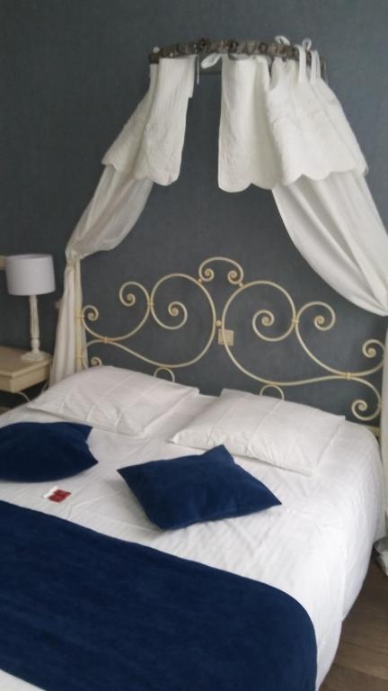 Postel nebo postele na pokoji v ubytování B&B Villa Des Raisins