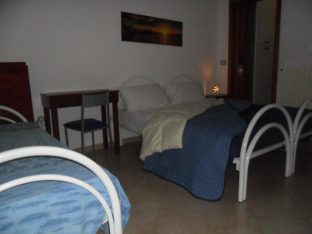 A bed or beds in a room at La Stanza Alternativa