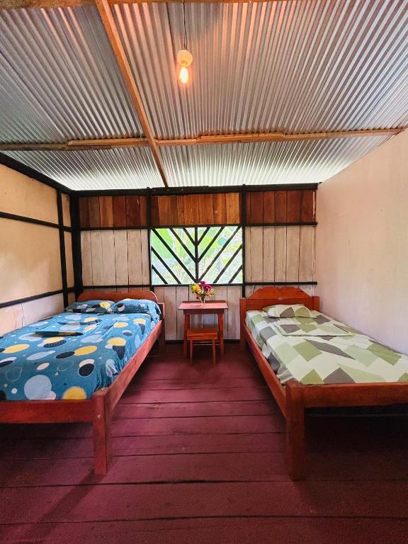 Postel nebo postele na pokoji v ubytování Amazon Renaco Lodge