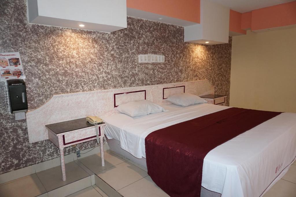 Postel nebo postele na pokoji v ubytování Hotel Rio Inn