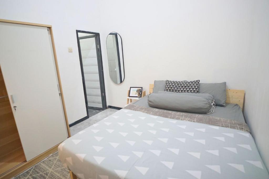 Postel nebo postele na pokoji v ubytování Casa de Vie Homestay