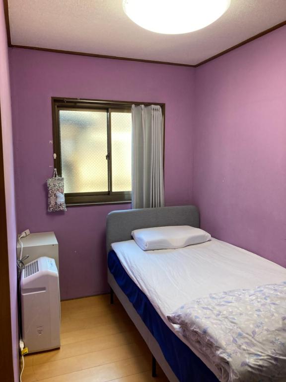 Postel nebo postele na pokoji v ubytování Hostel Blue Door ホステル ブルードア
