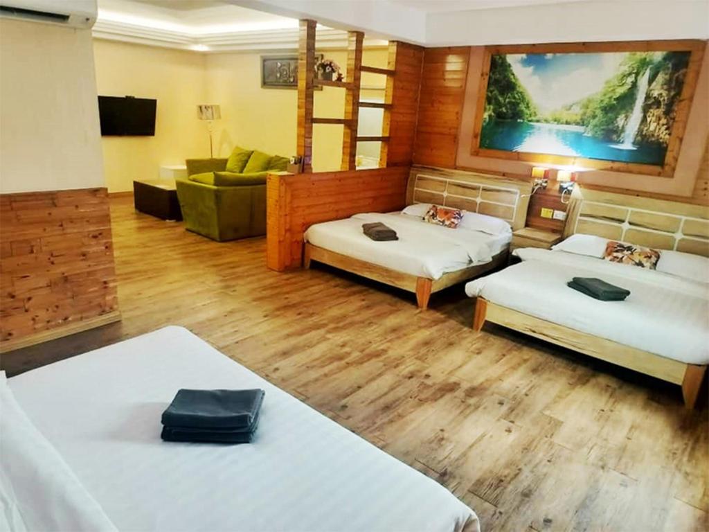 Postel nebo postele na pokoji v ubytování Hotel Balik Pulau