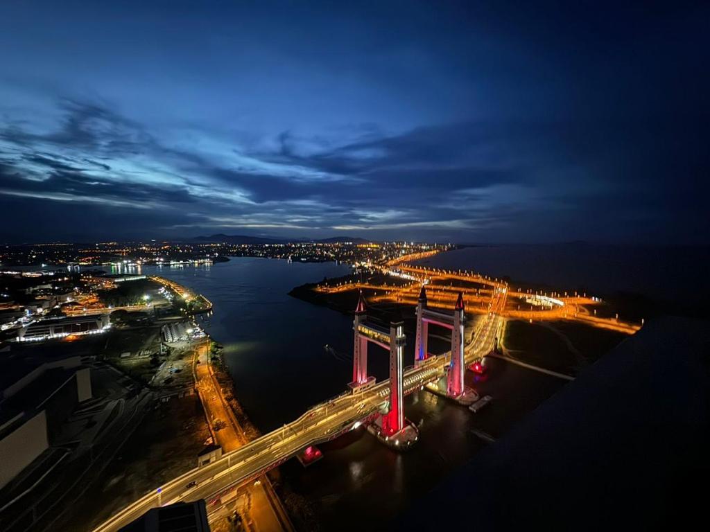 an aerial view of a bridge over a river at night at nearby umt unisza hosza litar gong badak airport chelong homestay kuala terengganu in Kampong Bukit Berangan