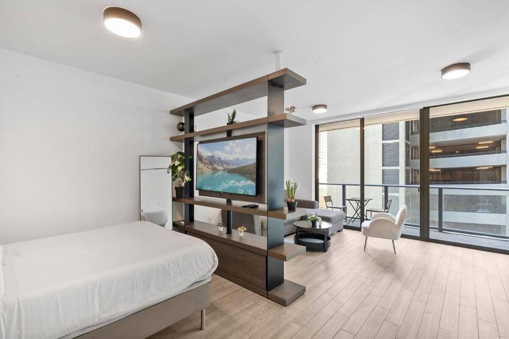 a bedroom with a bed and a tv in a room at Luxury Studio,Downtown Miami, in Miami