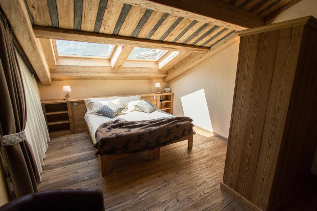 Postel nebo postele na pokoji v ubytování Hotel Les Montagnards