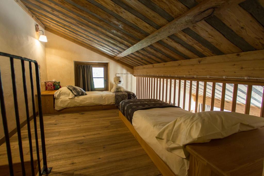 Postel nebo postele na pokoji v ubytování Hotel Les Montagnards