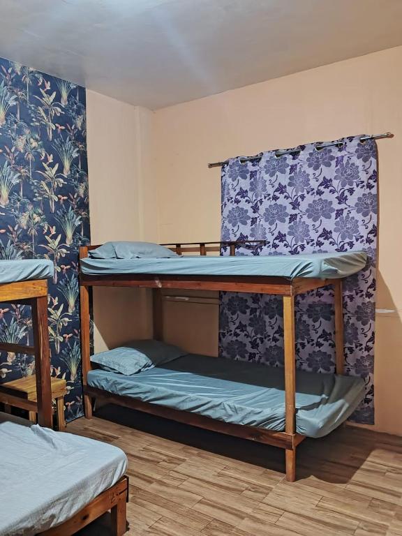 Postel nebo postele na pokoji v ubytování House Rental Banaba Tree