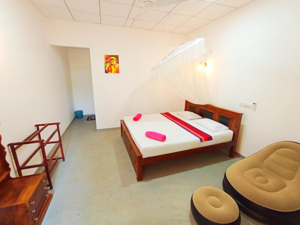 Postel nebo postele na pokoji v ubytování Bloom Guest House