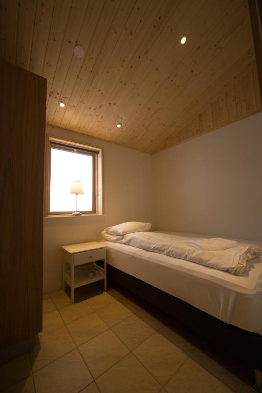 Postel nebo postele na pokoji v ubytování Dimmuborgir Guesthouse