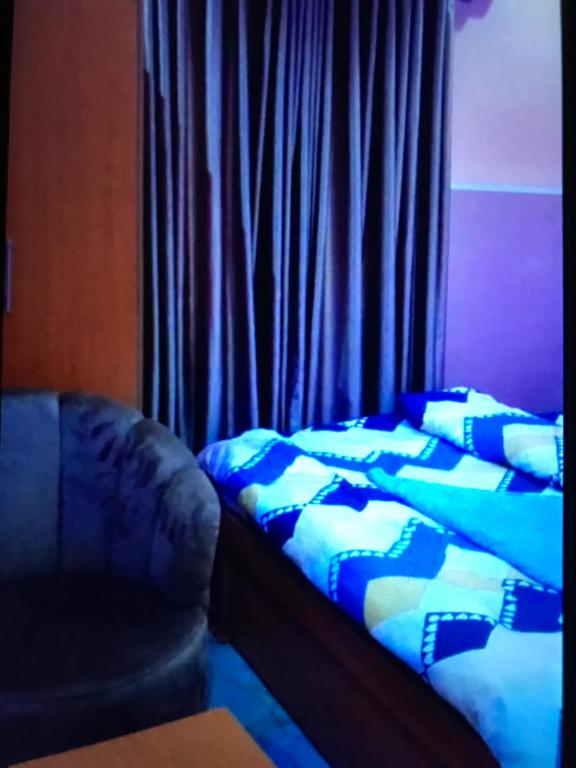Postel nebo postele na pokoji v ubytování Deep Diamonds hotel and suites