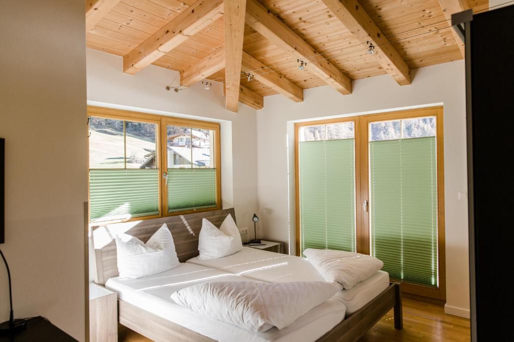 מיטה או מיטות בחדר ב-A Casa Residenz