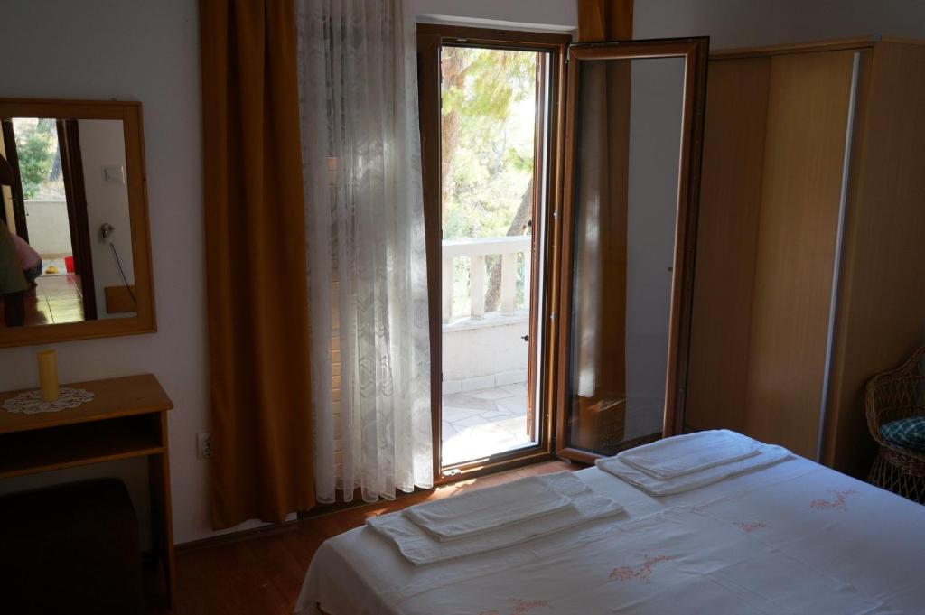 Postel nebo postele na pokoji v ubytování B&B Pansion Jure Matijević