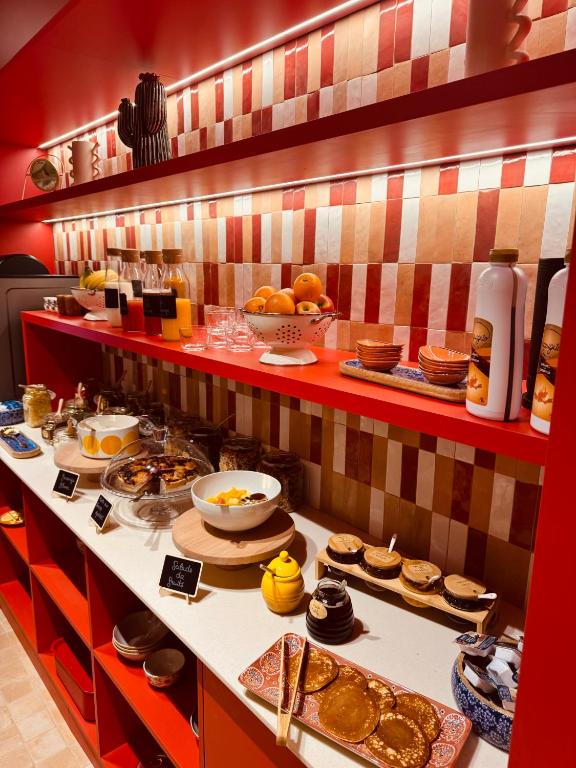 a buffet with a lot of food on a table at Hôtel Gabriel in Menton