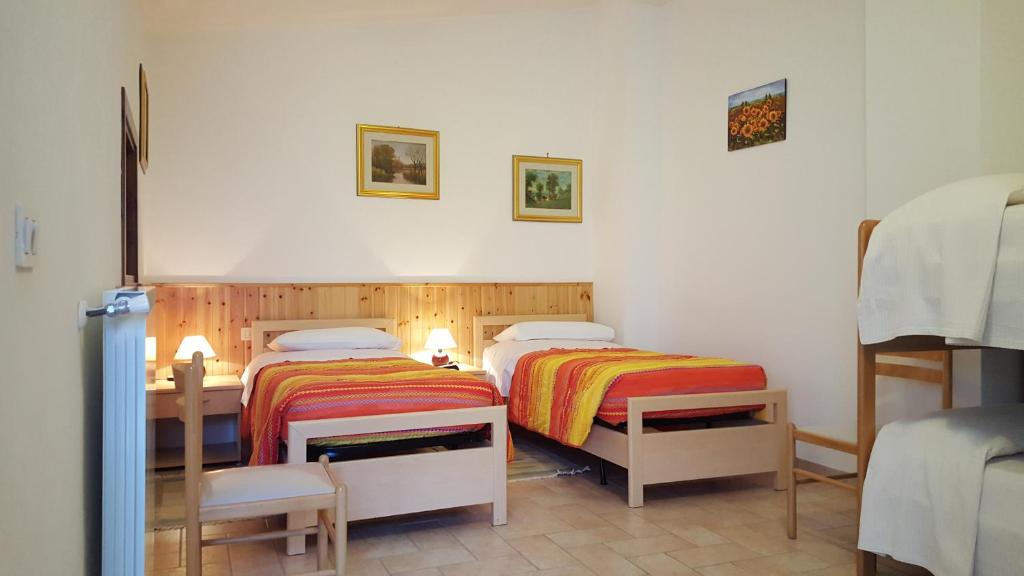 Postel nebo postele na pokoji v ubytování B&B Barbara Assisi