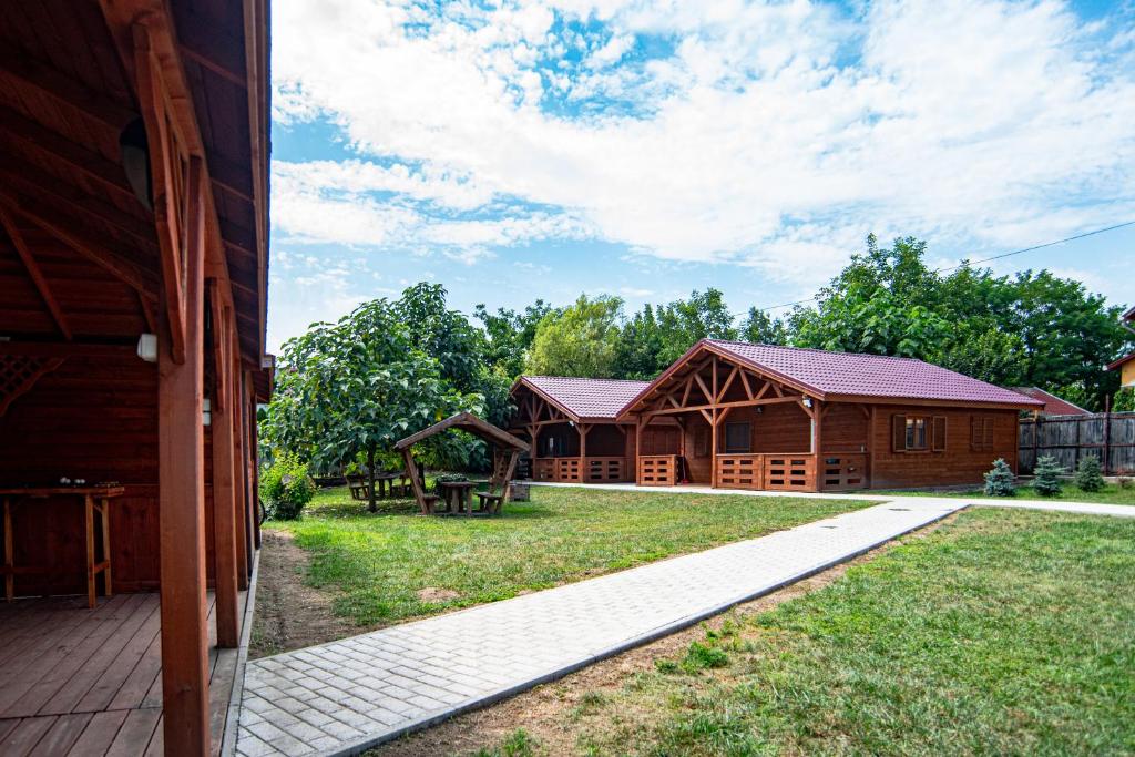 a view from the outside of a house with a yard at Adlin in Homokcsárda