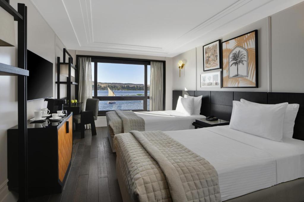 Postel nebo postele na pokoji v ubytování Mövenpick MS Sunray