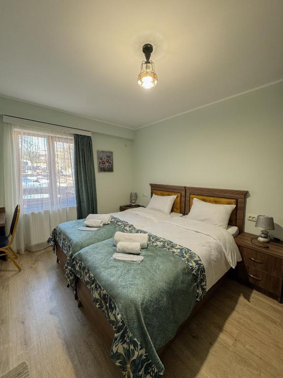 Postel nebo postele na pokoji v ubytování Lileo Kutaisi - Hotel&Winery
