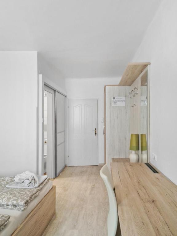 Postel nebo postele na pokoji v ubytování CityApt Wolfik Stockerau