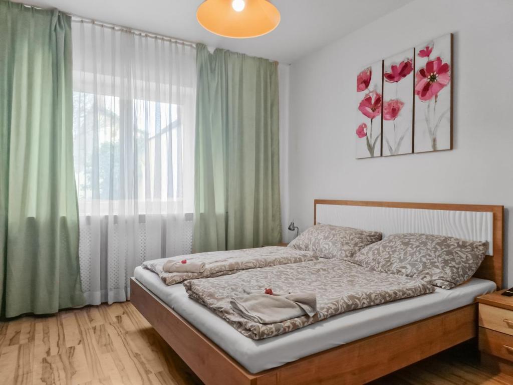 Postel nebo postele na pokoji v ubytování CityApt Wolfik Stockerau