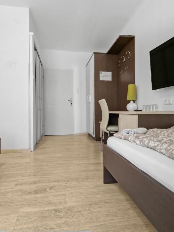 Postel nebo postele na pokoji v ubytování CityApt Wolfik Stockerau