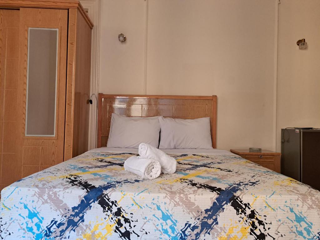 Postel nebo postele na pokoji v ubytování Philo Hotel