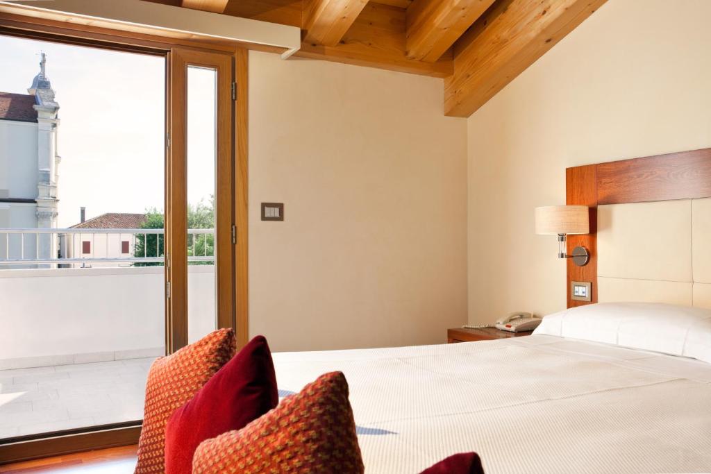 Posteľ alebo postele v izbe v ubytovaní Al Tezzon Hotel