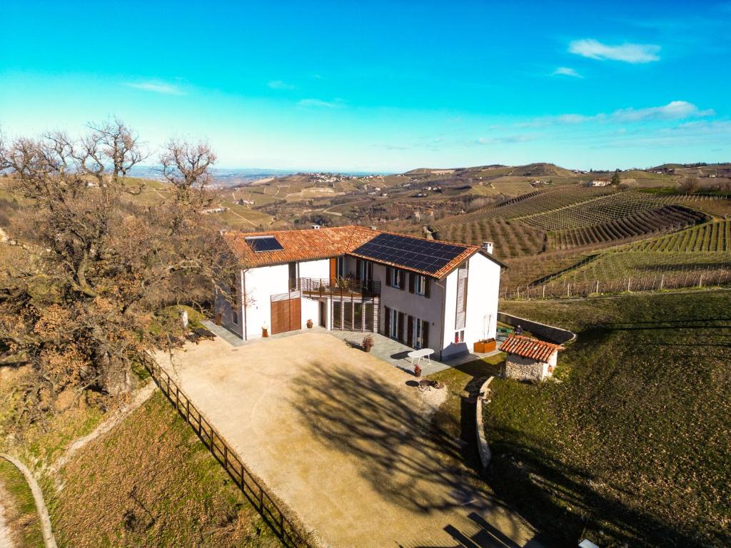 an aerial view of a house in a vineyard at Villa di Langa in Trezzo Tinella