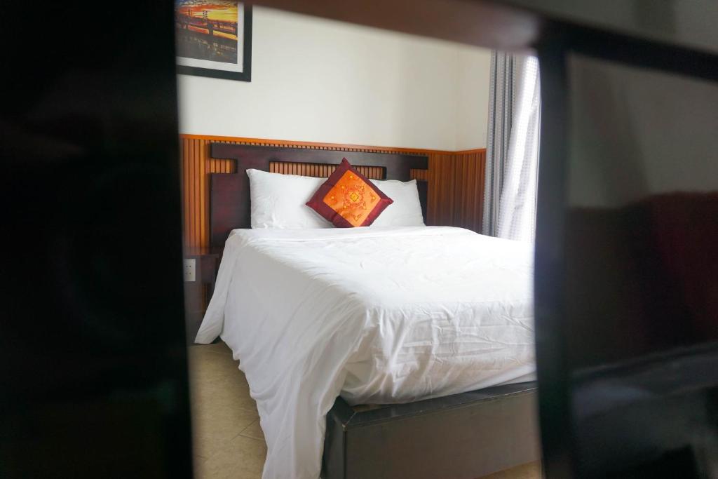 Postel nebo postele na pokoji v ubytování Paradise Hotel Hoi An