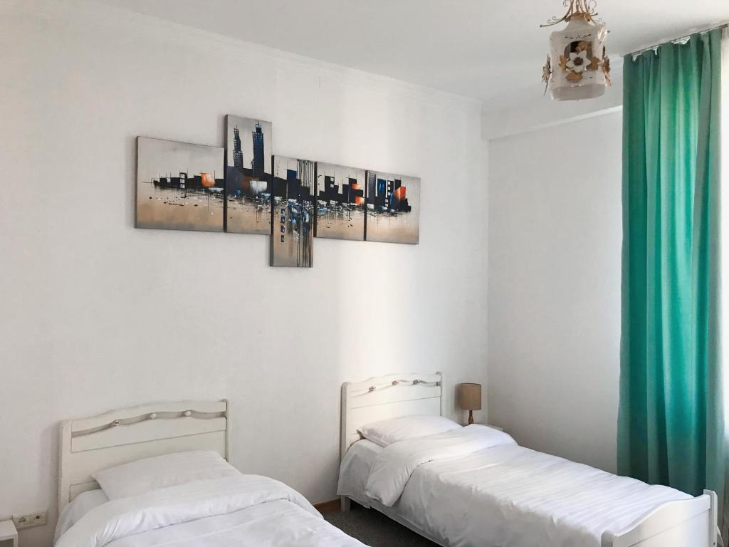 Postel nebo postele na pokoji v ubytování Hotel Gallery