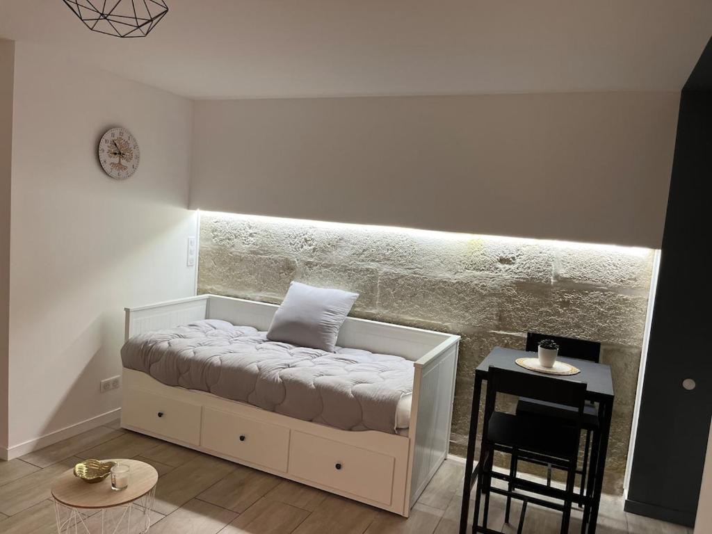 En eller flere senge i et værelse på Appartement