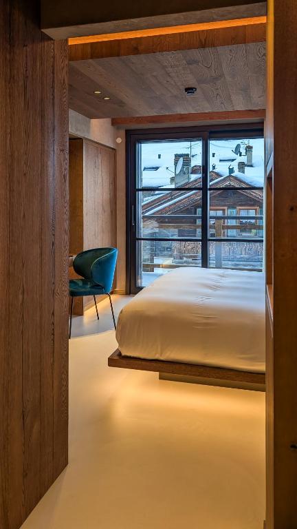Postel nebo postele na pokoji v ubytování Mohe Boutique Hotel